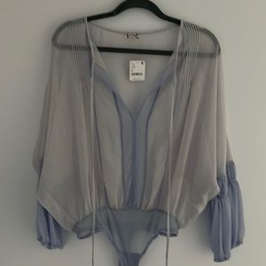 Free people light blue shear body suit. Size small